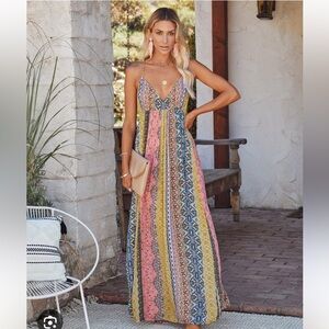 Multicolor maxi dress with low back and adjustable ties. Size small